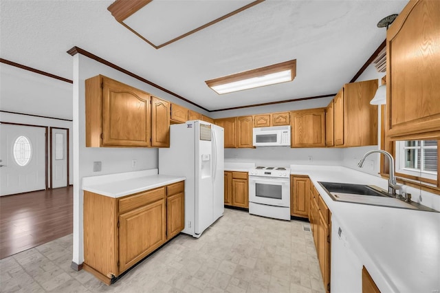 kitchen with white appliances, sink, and ornamental molding