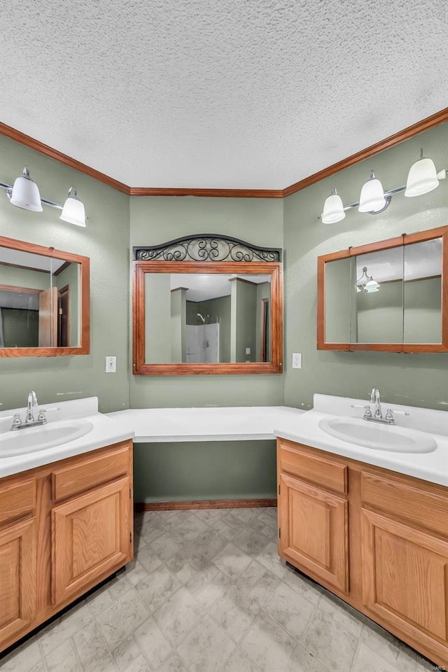 bathroom with crown molding and vanity