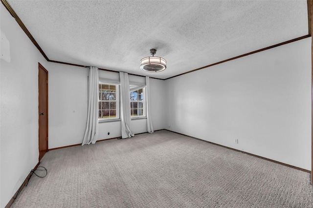 carpeted empty room with a textured ceiling