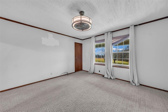 carpeted spare room featuring a textured ceiling