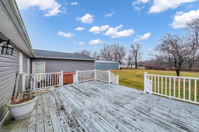 wooden deck featuring a yard