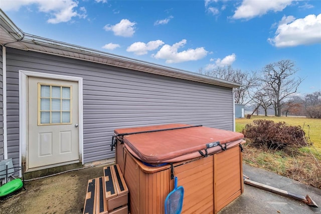 exterior space featuring a hot tub