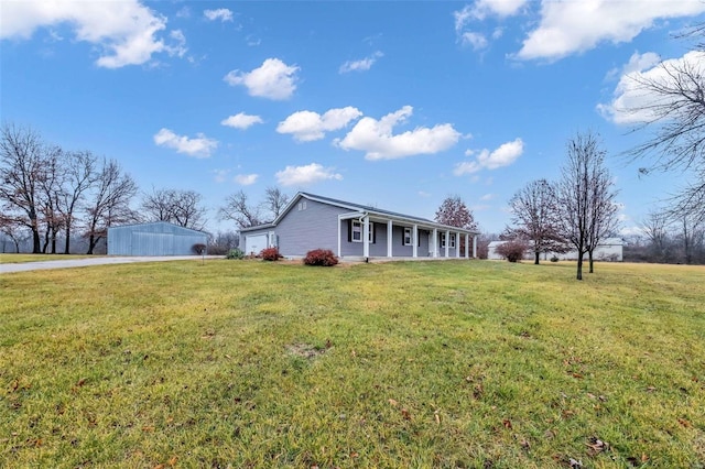 view of front of property with a front yard and a garage