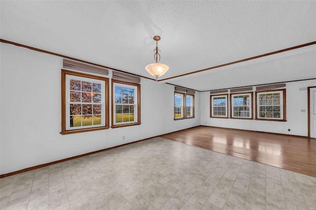 unfurnished living room featuring a textured ceiling, light hardwood / wood-style flooring, and ornamental molding