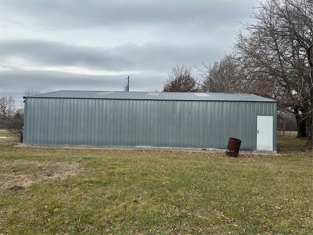 view of outdoor structure with a lawn