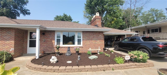 view of front of home with a carport