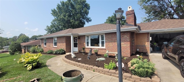 ranch-style house with a front yard and a garage