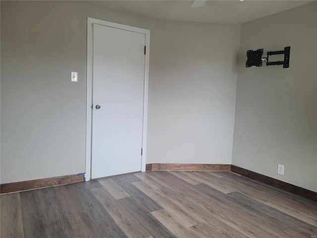 empty room with wood-type flooring