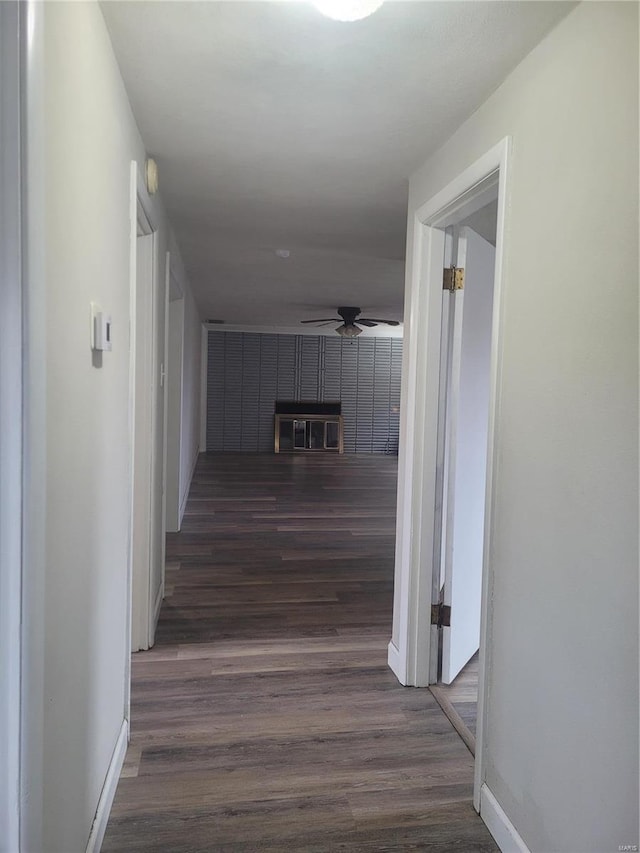 hall with dark hardwood / wood-style flooring