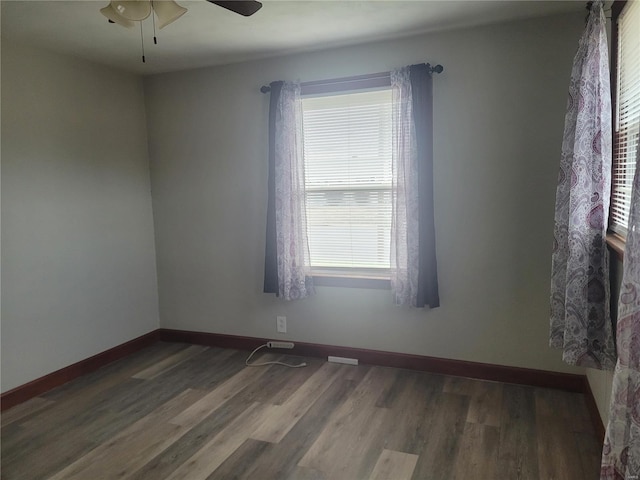 spare room with hardwood / wood-style flooring and ceiling fan