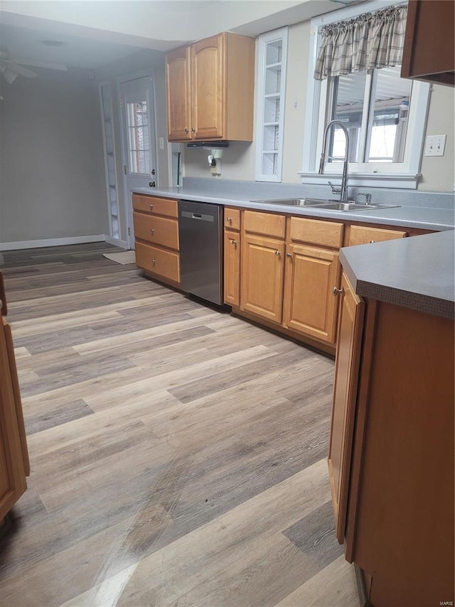 kitchen featuring light hardwood / wood-style floors, sink, and black dishwasher