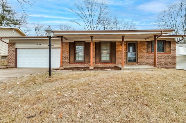 single story home featuring covered porch and a garage