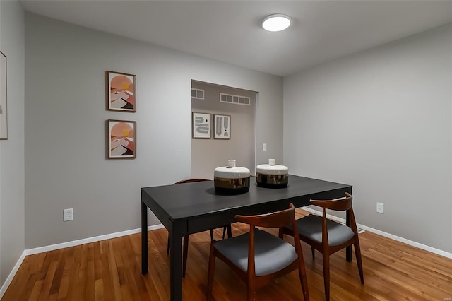 dining space featuring hardwood / wood-style floors