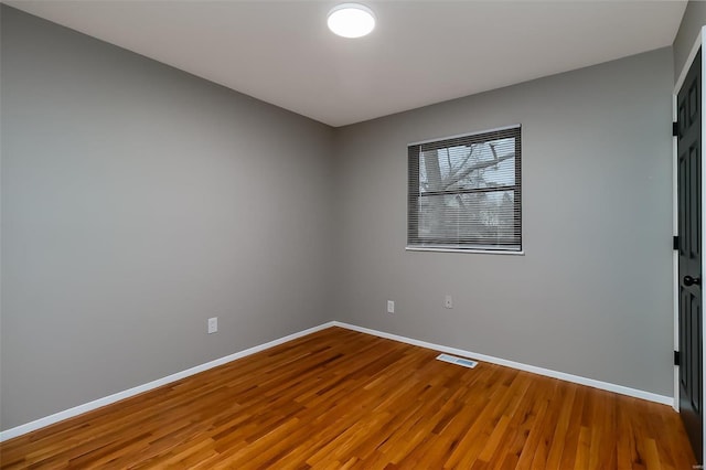 empty room featuring hardwood / wood-style floors