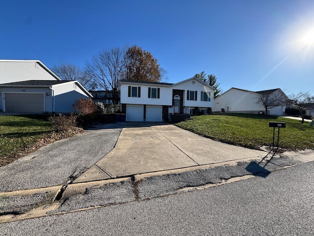 bi-level home with a front lawn and a garage