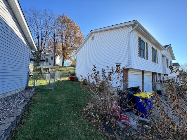 view of property exterior with a lawn and a garage