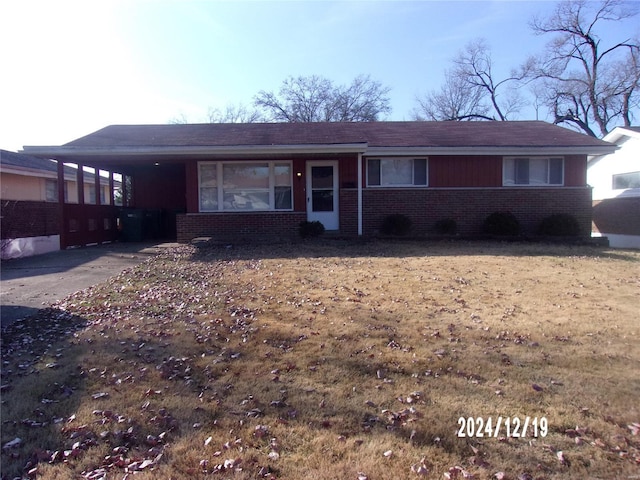 single story home featuring a carport