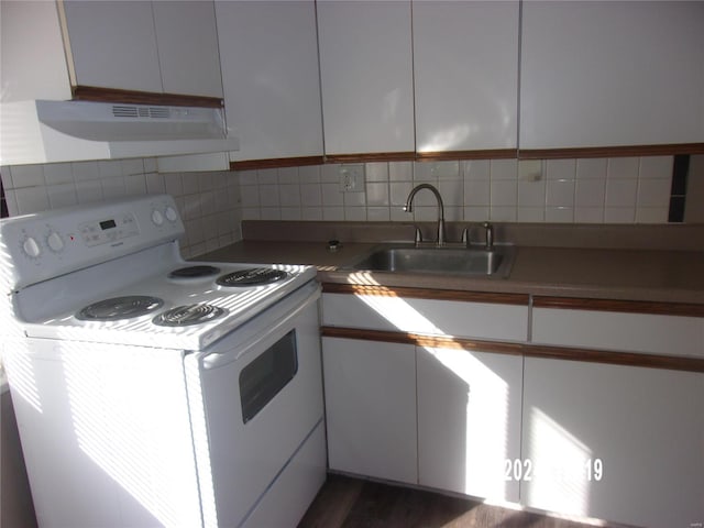 kitchen featuring a sink, decorative backsplash, white cabinets, under cabinet range hood, and white range with electric stovetop