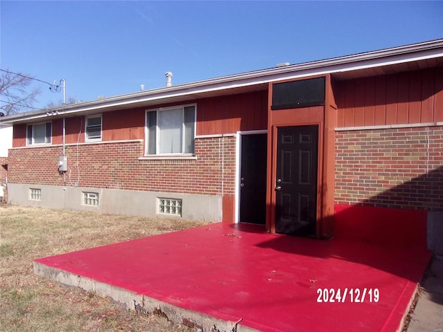 exterior space featuring brick siding