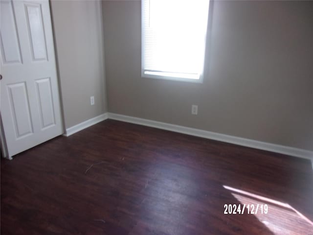 empty room featuring dark hardwood / wood-style floors