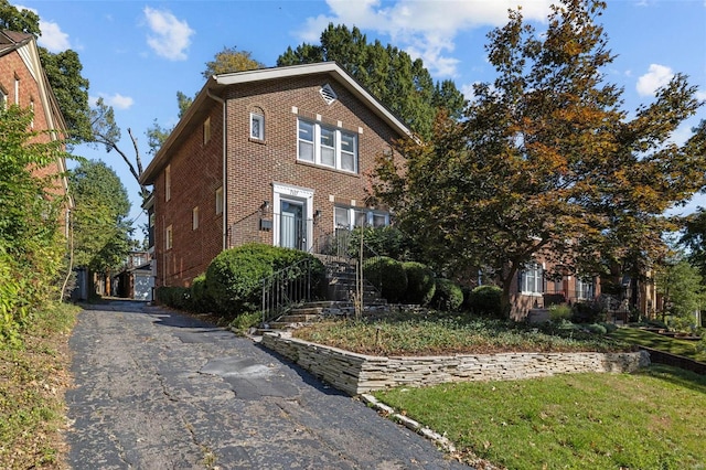 view of front of house with brick siding