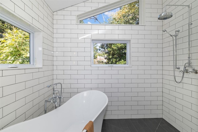 full bath with a freestanding bath and tiled shower