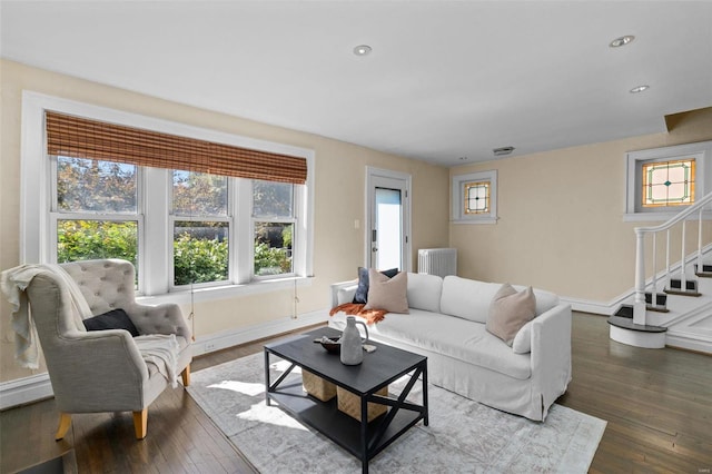 living area featuring recessed lighting, stairway, baseboards, and dark wood-style floors