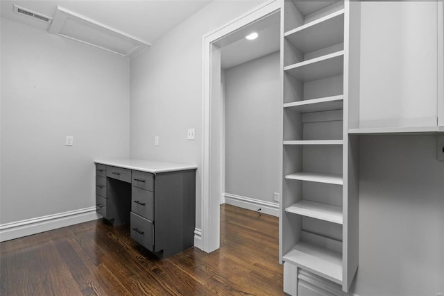 interior space featuring attic access, dark wood-style floors, and visible vents