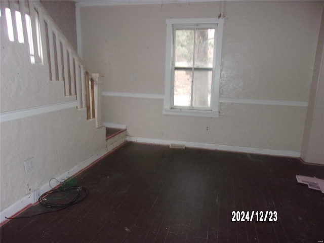 unfurnished room with dark hardwood / wood-style floors