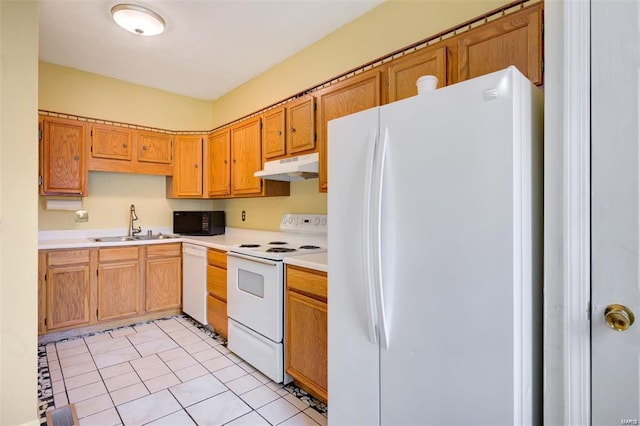 kitchen with light tile patterned flooring, white appliances, and sink