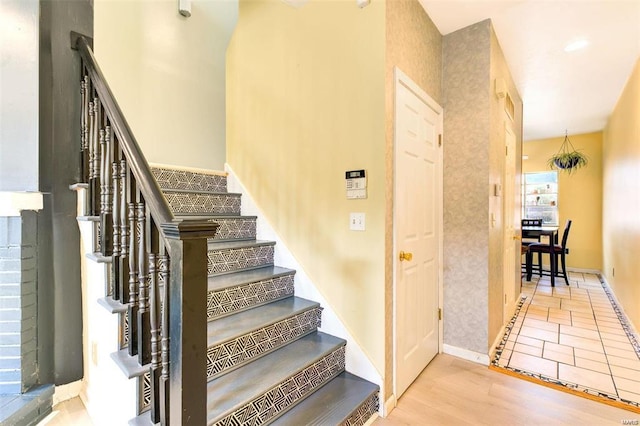 stairs with wood-type flooring