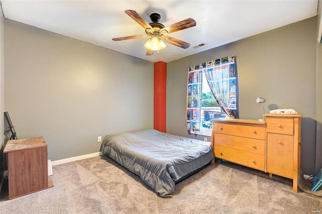 bedroom featuring light carpet and ceiling fan