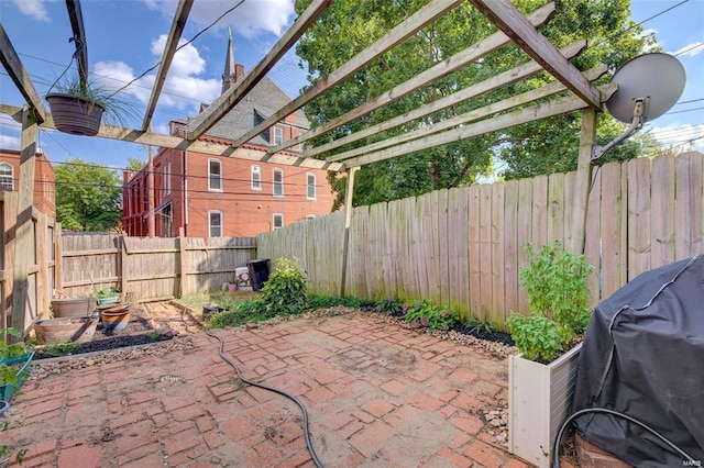 view of patio with a pergola and area for grilling