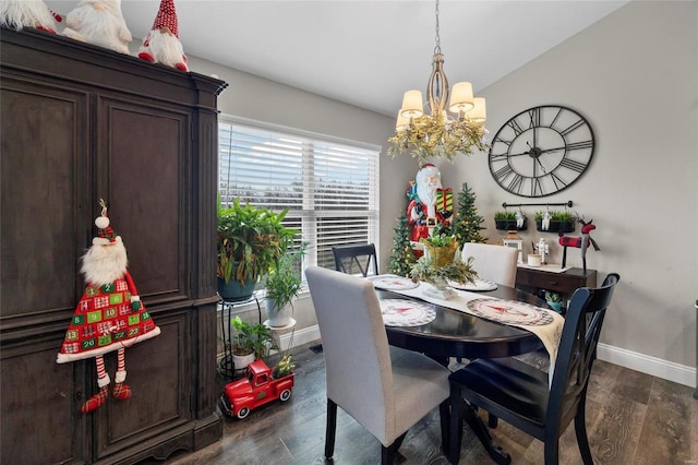 dining room with lofted ceiling, a chandelier, and dark hardwood / wood-style flooring