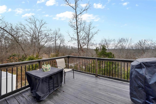 wooden terrace with area for grilling