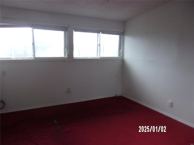 empty room with carpet and plenty of natural light