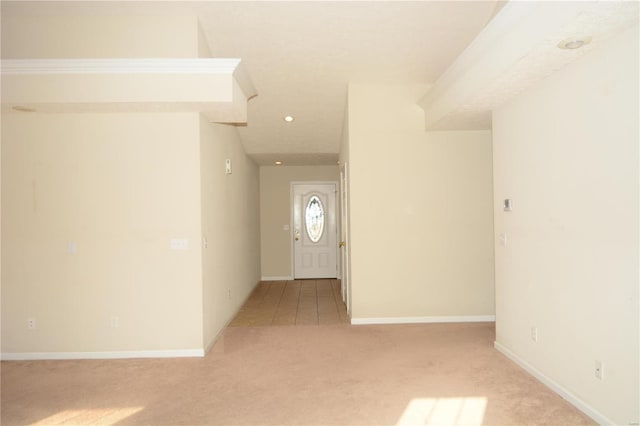 entrance foyer with light colored carpet