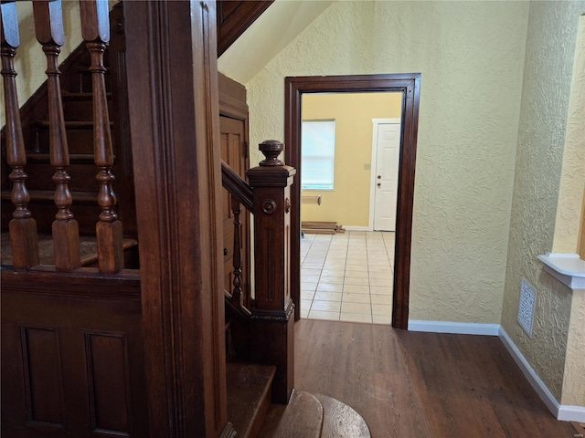 hallway with light hardwood / wood-style flooring