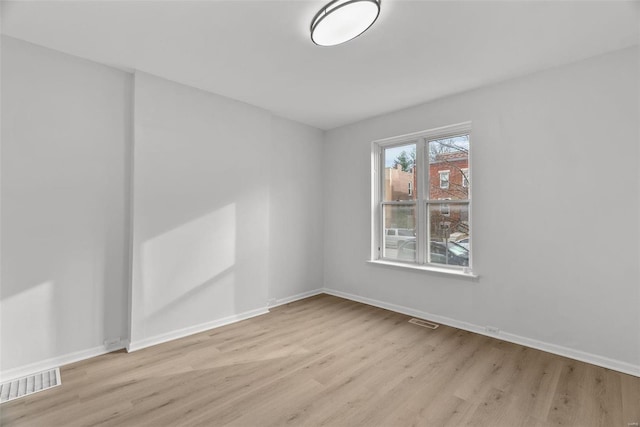 unfurnished room featuring light wood-type flooring