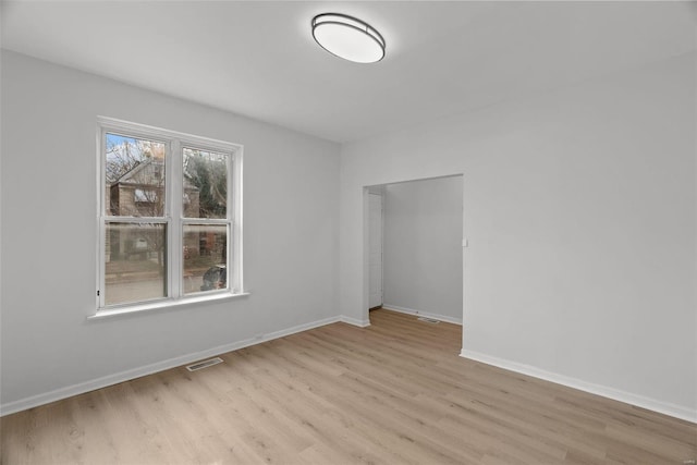 unfurnished room with light hardwood / wood-style flooring