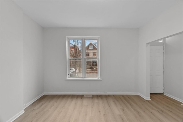 spare room with light hardwood / wood-style floors