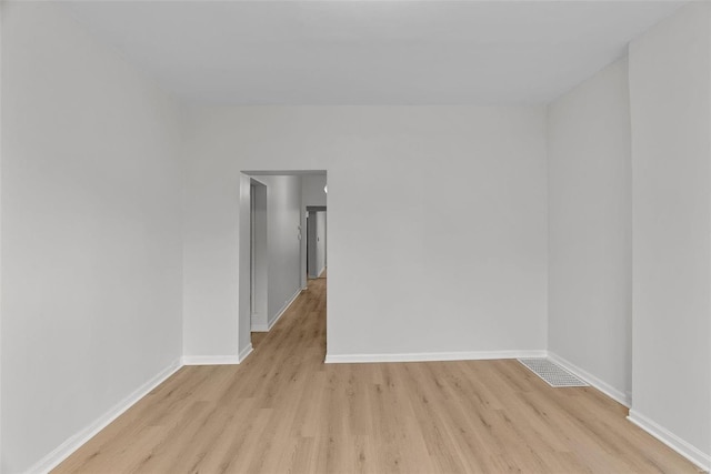 spare room featuring light hardwood / wood-style flooring