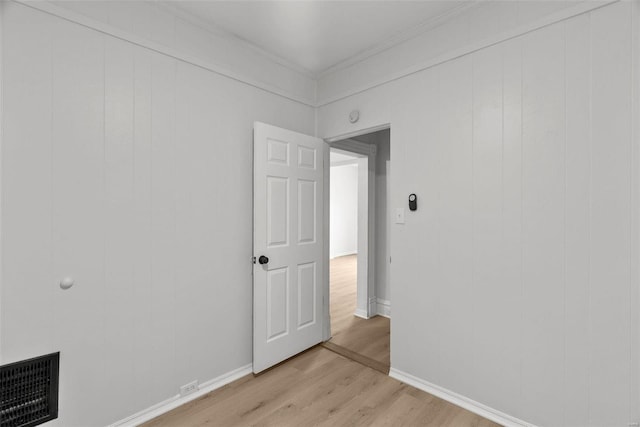 spare room featuring light wood-type flooring