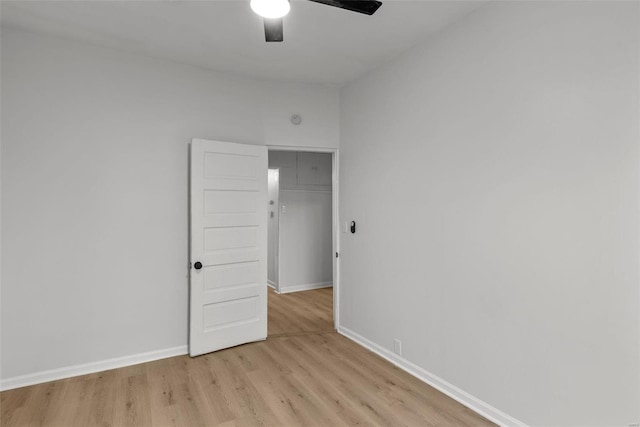 unfurnished room featuring ceiling fan and light wood-type flooring