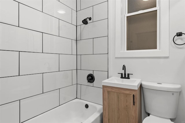 full bathroom with vanity, toilet, and tiled shower / bath combo