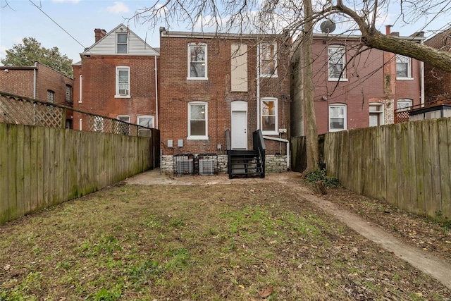 back of property featuring central air condition unit