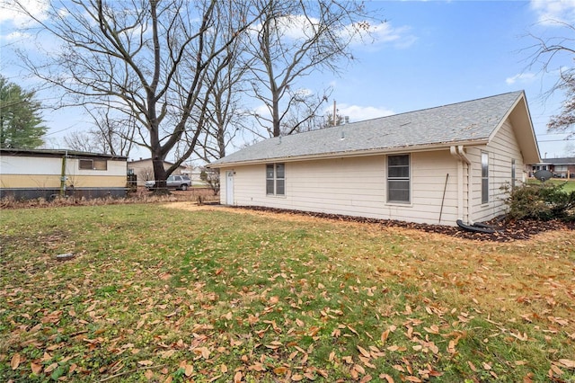 view of home's exterior with a yard