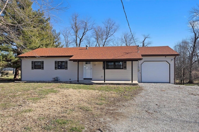 single story home with a front yard, a porch, and a garage