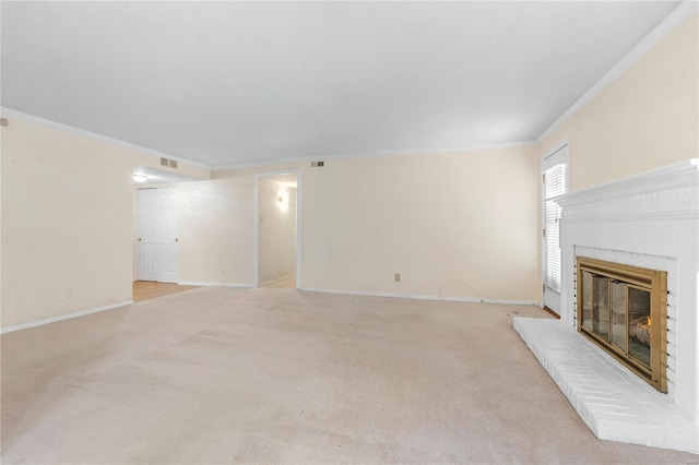 unfurnished living room featuring light colored carpet, ornamental molding, and a brick fireplace