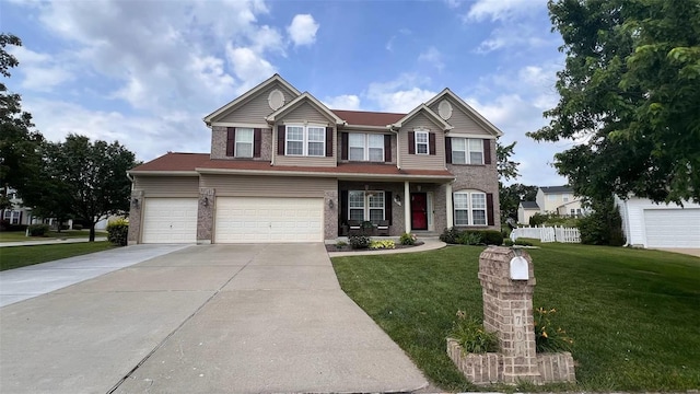 view of front of home featuring a front lawn and a garage